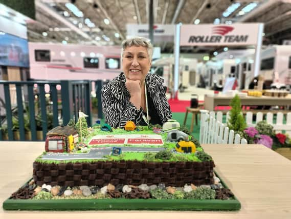 Karen Wright and the cake she made in honour of design awards