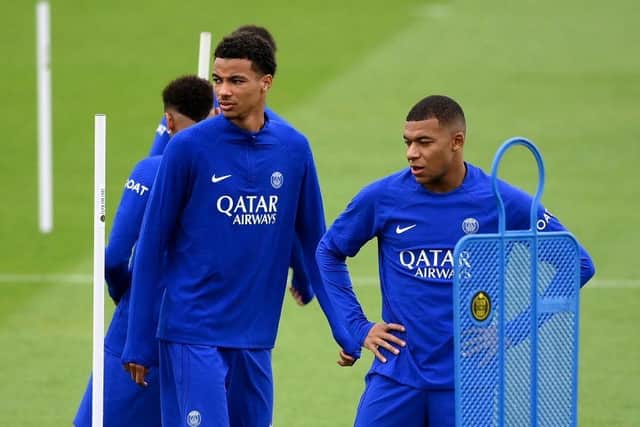 Paris Saint-Germain's French forward Hugo Ekitike and Paris Saint-Germain's French forward Kylian Mbappe take part in a training session at the club's training ground in Saint-Germain-en-Laye on September 13, 2022, on the eve of their UEFA Champions Leage first round group H football match against Maccabi Haifa. (Photo by FRANCK FIFE / AFP) (Photo by FRANCK FIFE/AFP via Getty Images)