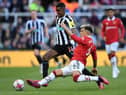 Newcastle United's Swedish striker Alexander Isak (L) vies with Manchester United's Argentinian defender Lisandro Martinez (R) during the English Premier League football match between Newcastle United and Manchester United at St James' Park in Newcastle-upon-Tyne, north east England on April 2, 2023. (Photo by Oli SCARFF / AFP) /