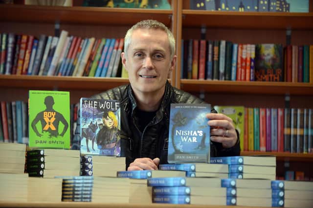 Award winning author Dan Smith with some of the books he has penned over the last decade.