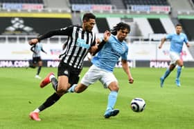 Manchester City defender Nathan Ake battling with Joelinton (Photo by Peter Powell - Pool/Getty Images)