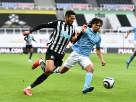 Manchester City defender Nathan Ake battling with Joelinton (Photo by Peter Powell - Pool/Getty Images)