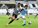 Manchester City defender Nathan Ake battling with Joelinton (Photo by Peter Powell - Pool/Getty Images)