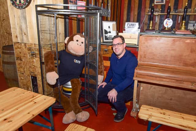 A monkey mascot in need of a name is pictured at 1 More than 2 Brew, in Portrberry Street, South Shieds, with bar manager Glen Towers.