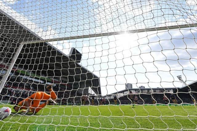 Newcastle United's English goalkeeper Nick Pope concedes the opening goal from a penalty kick by Brentford's English striker Ivan Toney during the English Premier League football match between Brentford and Newcastle United at Gtech Community Stadium in London on April 8, 2023. (Photo by Glyn KIRK / AFP)