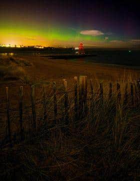 The aurora borealis above Herd Groyne Lighthouse.
Photograph: Steven Lomas