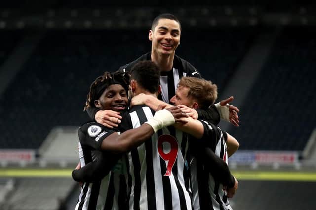 Joelinton of Newcastle United celebrates with Allan Saint-Maximin, Miguel Almiron and Matt Ritchie after scoring their side's second goal during the Premier League match between Newcastle United and Manchester City at St. James Park on May 14, 2021 in Newcastle upon Tyne, England.