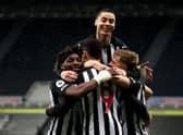 Joelinton of Newcastle United celebrates with Allan Saint-Maximin, Miguel Almiron and Matt Ritchie after scoring their side's second goal during the Premier League match between Newcastle United and Manchester City at St. James Park on May 14, 2021 in Newcastle upon Tyne, England.
