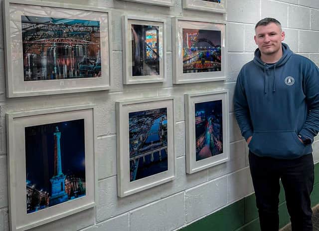 Darren Wardle with some of his pictures.