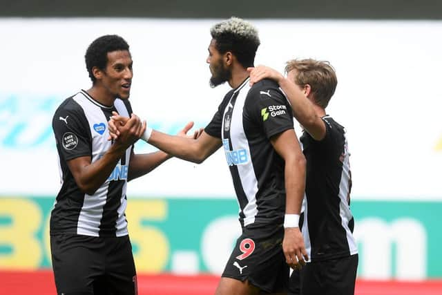 Isaac Hayden, left, congratulates goalscorer Joelinton.