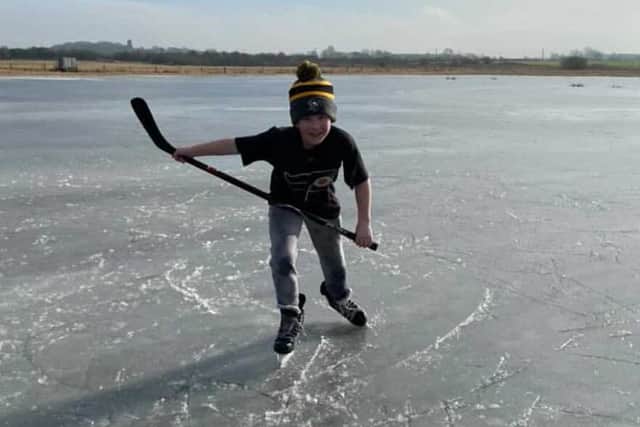 Eight-year-old Oliver Payette enjoys surprise holiday outing on the ice, after months of ice hockey practice cancellations