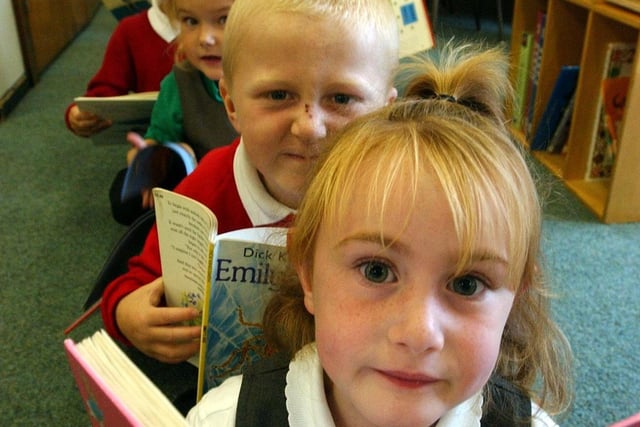 Who recognises the pupils who were having their own sponsored silent read at the school 18 years ago?