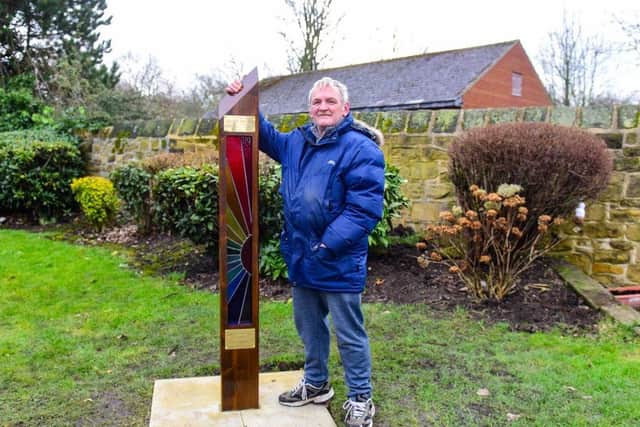 Chairman of Friends of Hebburn Cemetery, John Stewart with the memorial paying tribute to the victims of the pandemic.