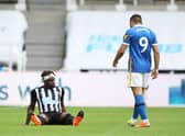 Newcastle United's French midfielder Allan Saint-Maximin sits on the pitch after being injured during the English Premier League football match between Newcastle United and Brighton and Hove Albion at St James' Park in Newcastle upon Tyne, north-east England on September 20, 2020.