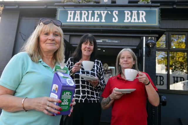 Harley's Bar owner Charlotte Bell, who held a fundraiser for Macmillan with help from customer Heather Graham and bar worker Maxine Maxwell (R).
