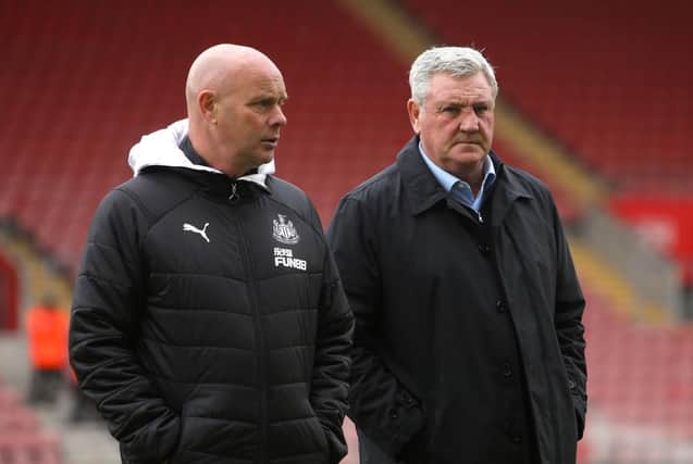 SOUTHAMPTON, ENGLAND - MARCH 07: Steve Agnew, First team coach of Newcastle United (L) and Steve Bruce, Manager of Newcastle United (R) inspect the pitch prior to the Premier League match between Southampton FC and Newcastle United at St Mary's Stadium on March 07, 2020 in Southampton, United Kingdom. (Photo by Charlie Crowhurst/Getty Images)