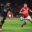 Nimes' French forward Renaud Ripart (R) vies with Marseille's Guinean midfielder Bouna Sarr (L) during the French L1 football match Nimes vs Olympique de Marseille, on February 28, 2020 at the Costieres stadium in Nimes. (Photo by Pascal GUYOT / AFP) (Photo by PASCAL GUYOT/AFP via Getty Images)
