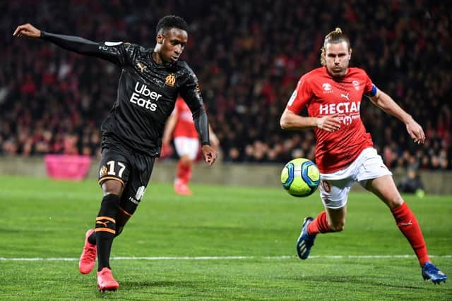 Nimes' French forward Renaud Ripart (R) vies with Marseille's Guinean midfielder Bouna Sarr (L) during the French L1 football match Nimes vs Olympique de Marseille, on February 28, 2020 at the Costieres stadium in Nimes. (Photo by Pascal GUYOT / AFP) (Photo by PASCAL GUYOT/AFP via Getty Images)