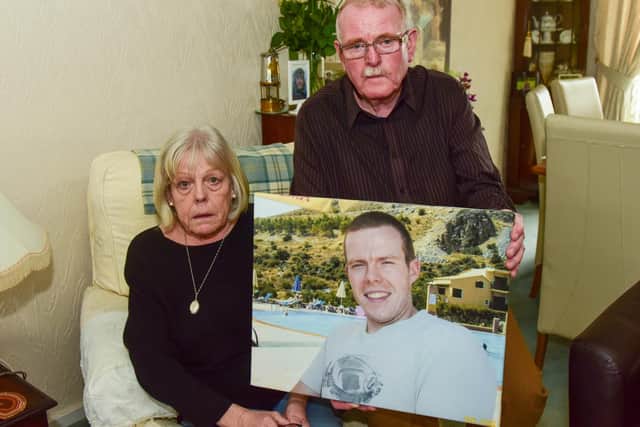 Dan and Linda Golden, of Chapel Garth, Sunderland, with a photograph of their late son, Frazer Golden, were praised for their dignity by the coroner investigating their son's death.