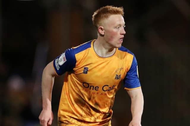Matty Longstaff of Mansfield Town runs with the ball during the Sky Bet League Two match between Tranmere Rovers and Mansfield Town at Prenton Park on March 11, 2022 in Birkenhead, England. (Photo by Lewis Storey/Getty Images)