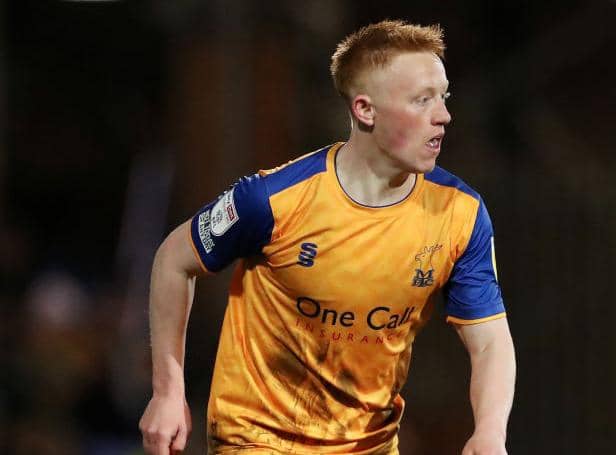 Matty Longstaff of Mansfield Town runs with the ball during the Sky Bet League Two match between Tranmere Rovers and Mansfield Town at Prenton Park on March 11, 2022 in Birkenhead, England. (Photo by Lewis Storey/Getty Images)
