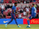 Marcus Rashford of England celebrates after scoring from the penalty spot.