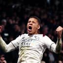 Dwight Gayle celebrates a goal for Derby. (Photo by Naomi Baker/Getty Images).