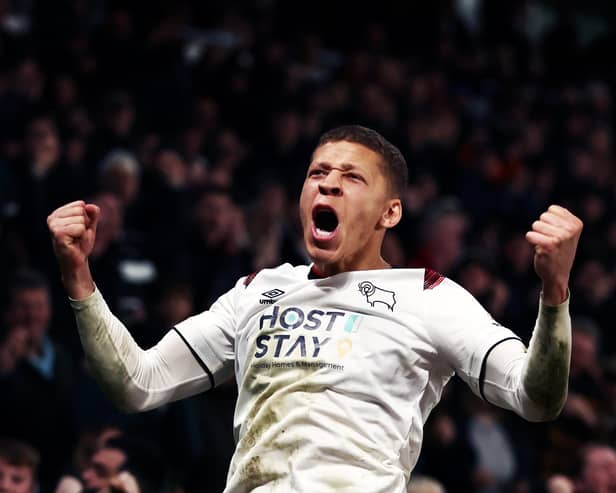 Dwight Gayle celebrates a goal for Derby. (Photo by Naomi Baker/Getty Images).