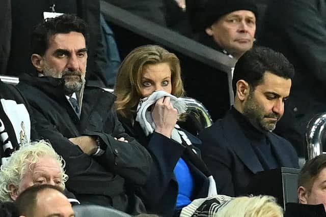 Newcastle United's Saudi Arabian chairman Yasir Al-Rumayyan (L), Newcastle United's English minority owner Amanda Staveley (C) and her husband Mehrdad Ghodoussi (R) look on during the English FA Cup third round football match between Newcastle United and Cambridge United at St James' Park in Newcastle-upon-Tyne, north east England on January 8, 2022. (Photo by PAUL ELLIS/AFP via Getty Images)