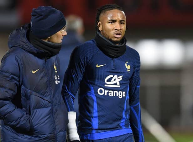 France's national football team forward Christopher Nkunku (R) reacts after injured during a training session at the team's training camp in Clairefontaine-en-Yvelines, south of Paris, on November 15, 2022, five days ahead of the Qatar 2022 FIFA World Cup football tournament. (Photo by Bertrand GUAY / AFP) (Photo by BERTRAND GUAY/AFP via Getty Images)