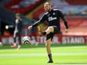 Newcastle United's English striker Andy Carroll warms up ahead of the English Premier League football match between Liverpool and Newcastle United at Anfield in Liverpool, north west England on April 24, 2021.