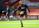 Newcastle United's English striker Andy Carroll warms up ahead of the English Premier League football match between Liverpool and Newcastle United at Anfield in Liverpool, north west England on April 24, 2021.