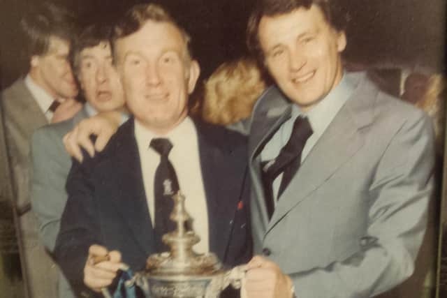 Mr Hobson (left) holding the 1978 FA Cup with then-Ipswich manager Bobby Robson.