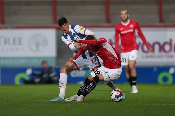 Hartlepool United's Ellis Taylor battles for possession with Morecambe's Shane McLoughlin during the EFL Trophy match between Morecambe and Hartlepool United at the Globe Arena. (Credit: Mark Fletcher | MI News)