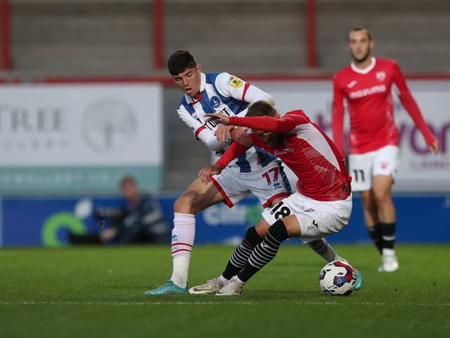 Hartlepool United's Ellis Taylor battles for possession with Morecambe's Shane McLoughlin during the EFL Trophy match between Morecambe and Hartlepool United at the Globe Arena. (Credit: Mark Fletcher | MI News)