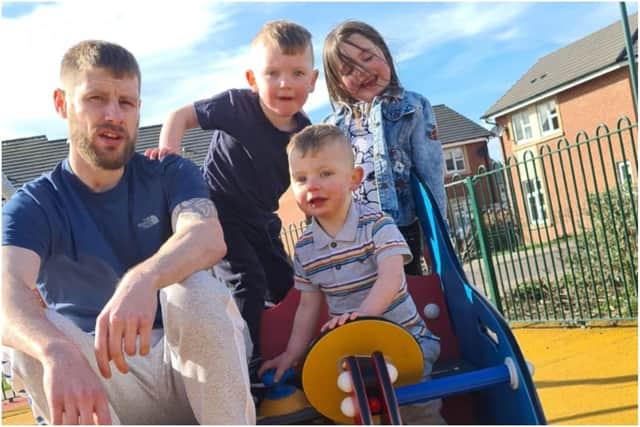 Robbie with step-dad Corey Wilson and siblings Alfie and Ava.