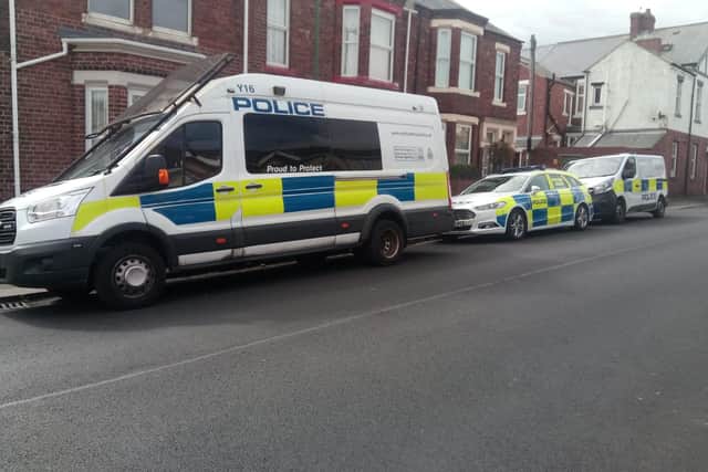 A number of police vehicles have been spotted in the street.