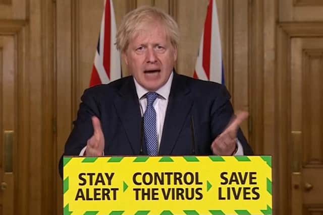 Prime Minister Boris Johnson speaks to the media on Friday.