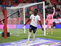 England's defender Bukayo Saka celebrates scoring the opening goal during the international friendly football match between England and Austria at the Riverside Stadium.