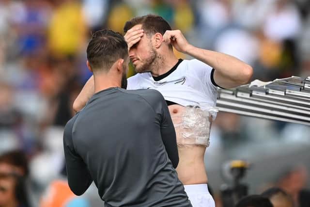 Chris Wood of the Whites receives medical assistance during the International Friendly match between the New Zealand All Whites and Australia Socceroos at Eden Park on September 25, 2022 in Auckland, New Zealand. (Photo by Hannah Peters/Getty Images)