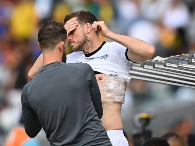 Chris Wood of the Whites receives medical assistance during the International Friendly match between the New Zealand All Whites and Australia Socceroos at Eden Park on September 25, 2022 in Auckland, New Zealand. (Photo by Hannah Peters/Getty Images)