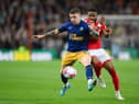 Kieran Trippier of Newcastle United is challenged by Emmanuel Dennis of Nottingham Forest during the Premier League match between Nottingham Forest and Newcastle United at City Ground on March 17, 2023 in Nottingham, England. (Photo by Shaun Botterill/Getty Images)