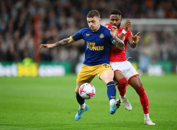 Kieran Trippier of Newcastle United is challenged by Emmanuel Dennis of Nottingham Forest during the Premier League match between Nottingham Forest and Newcastle United at City Ground on March 17, 2023 in Nottingham, England. (Photo by Shaun Botterill/Getty Images)