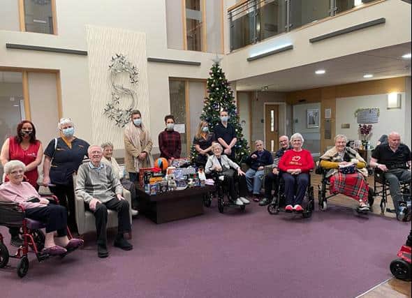 Residents and staff at Bramble Court, South Shields, with their donations
