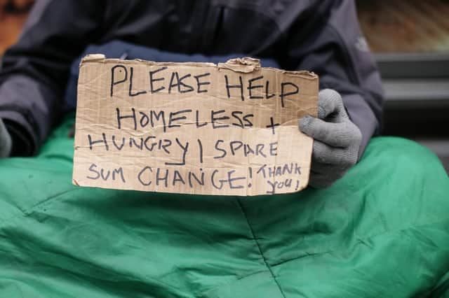 File picture from PA of someone begging as questions are asked over a new policy on tackling 'nuisance' behaviour in South Tyneside