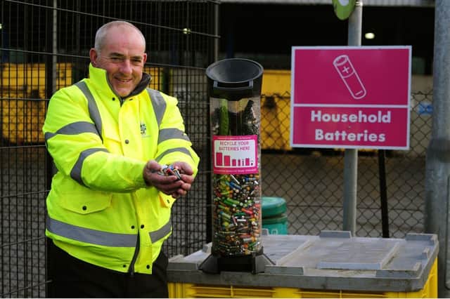 Cllr Ernest Gibson disposing of batteries at Middlefields. Picture taken before the current stay-at-home order was in place