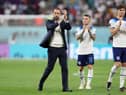 Gareth Southgate, Head Coach of England, applauds fans with Kieran Trippier and John Stones after the 6-2 win during the FIFA World Cup Qatar 2022 Group B match between England and IR Iran at Khalifa International Stadium on November 21, 2022 in Doha, Qatar. (Photo by Richard Heathcote/Getty Images)
