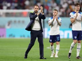 Gareth Southgate, Head Coach of England, applauds fans with Kieran Trippier and John Stones after the 6-2 win during the FIFA World Cup Qatar 2022 Group B match between England and IR Iran at Khalifa International Stadium on November 21, 2022 in Doha, Qatar. (Photo by Richard Heathcote/Getty Images)