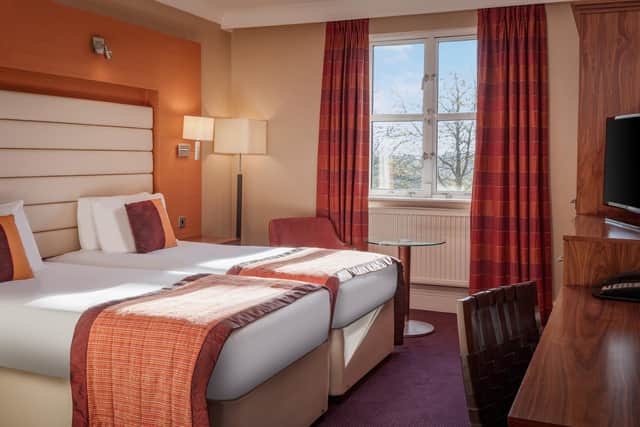 A twin room with comfortable twin beds and an en-suite bathroom. Image: Pellier Photography