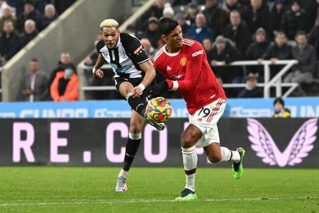 The ball hits the hand of Raphael Varane of Manchester United following a shot from Joelinton of Newcastle United during the Premier League match between Newcastle United  and  Manchester United at St James' Park on December 27, 2021 in Newcastle upon Tyne, England. (Photo by Stu Forster/Getty Images)